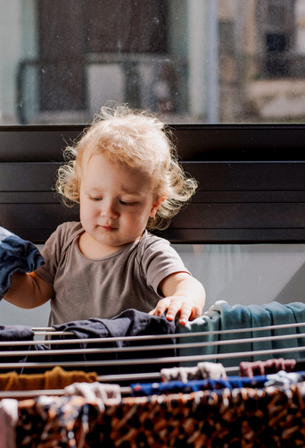 toddler drying clothes