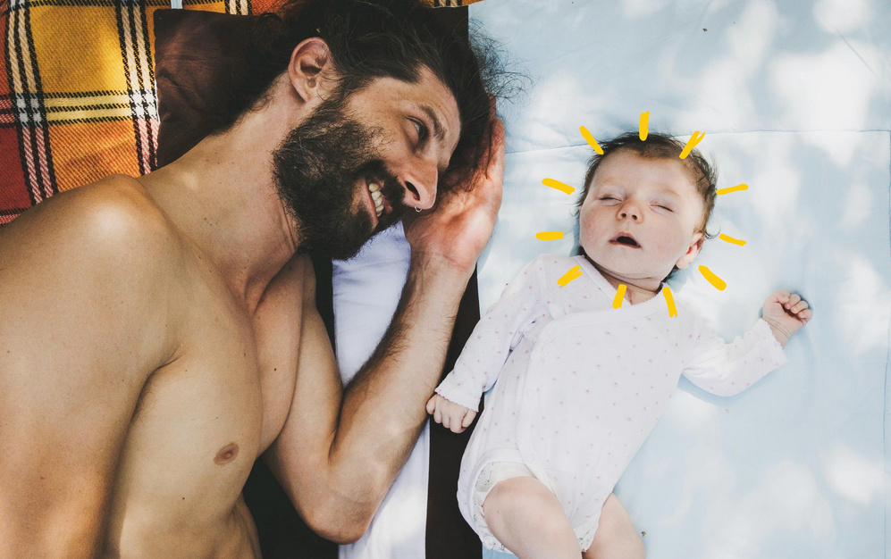 dad lying down beside sleeping baby sunshine